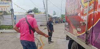 BORDER CONTROLS. Personnel of the Iloilo City Government’s African Swine Fever (ASF) taskforce disinfect a delivery truck transporting animal, pork and pork by-products. The city government has banned the entry of live hogs, pork and pork by-products from Oton, Iloilo – ground zero of ASF infection – and is strengthening its border control in five different locations – Sto. Niño Sur/Alegre, Mohon/Oton, Pakiad/Sooc, Hibao-an/San Miguel, and Calahunan. ILOILO CITY GOVERNMENT FB PAGE PHOTO