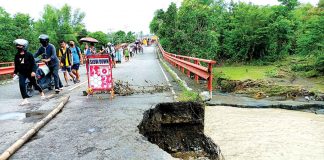 The Oyungan Bridge in Barangay Oyungan, Miag-ao, Iloilo is impassable to vehicles due to soil collapse and damaged slope protection on its approach (right side of the bridge). AJ PALCULLO/PN