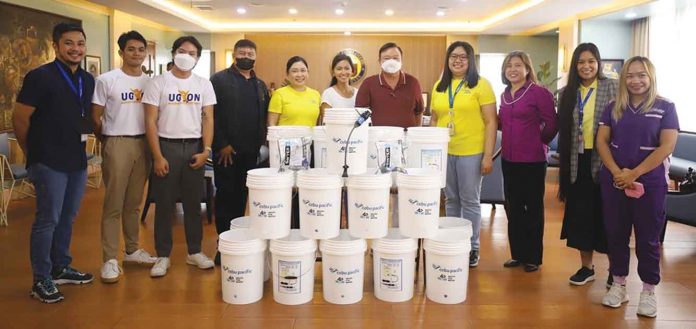 ceb-pac Cebu Pacific and Waves For Water Philippines turn over filtration systems to the city and provincial government of Iloilo.