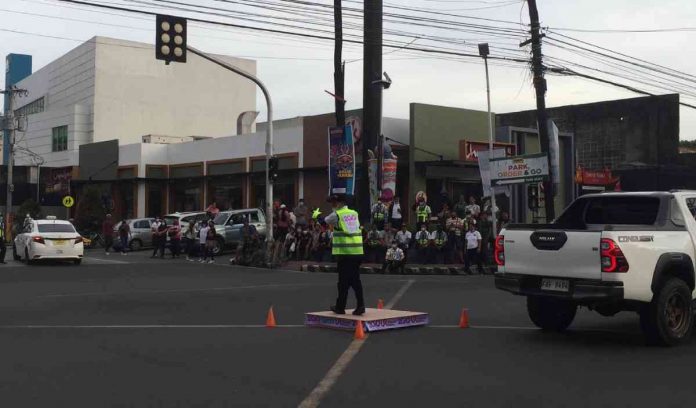 dancing-enforcer-bacolod-2022 Photo shows yesterday's (October 5) elimination round of the 2022 "Dancing Traffic Enforcers" competition at Corner Lacson St., BS Aquino Drive.