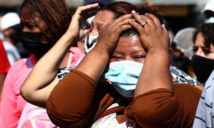 ecuador-prison-gang-fight Relatives waited for news after police stormed the jail in Guayaquil where a deadly riot took place. BBC