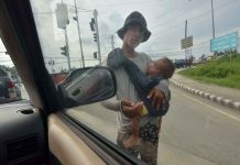Badjaos, especially kids, are known to climb jeepneys and beg for money from the passengers. Photo shows a Badjao man with his child in Iloilo City knocking on the window of vehicles asking for alms. PN FILE PHOTO