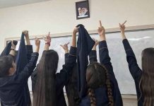 Iran determined to enforce hijab rules Protesting Iranian school girls raise their middle fingers – an obscene gesture – at the portraits of Ayatollah Khamenei and the founder of the Islamic Republic, Ayatollah Ruhollah Khomeini. BBC