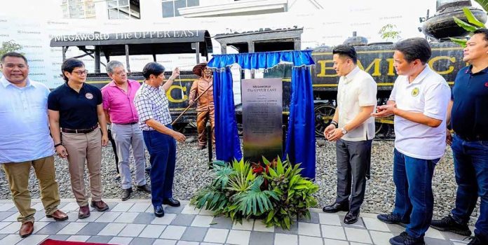 megaworld President Ferdinand R. Marcos, Jr. leads the formal inauguration of The Upper East in Bacolod City by unveiling a historic township marker fronting a historic sugar train that witnessed the glorious years of the Bacolod-Murcia Milling Company, where Megaworld is presently building Bacolod’s new central business district.