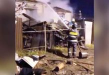 Russian fighter plane crashes in Siberian city A fireman sprays water to a burning house after a military plane crashed into it in Siberia, Russia. BBC