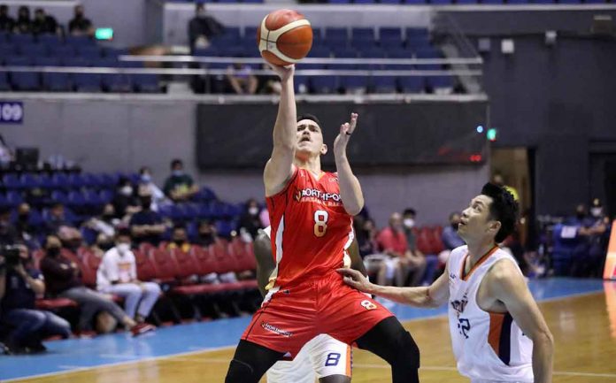 sports-Bolick-pic-and-caption NorthPort Batang Pier’s Robert Bolick Jr. forces a tough layup as Meralco Bolts’ Allein Maliksi looks on. PB MEDIA BUREAU