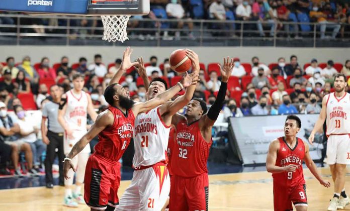 sports-Gin-pic-and-caption Barangay Ginebra San Miguel Kings’ guard Stanley Pringle swipes the ball from Bay Area Dragons’ 7-foot-5 center Liu Chuanxing. PBA MEDIA BUREAU