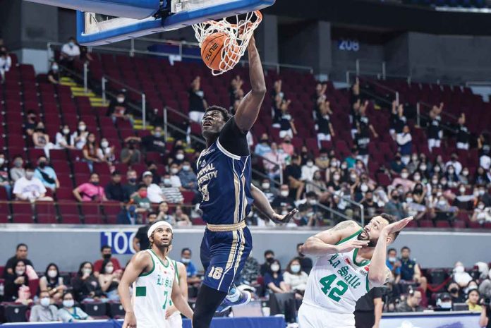 sports-NU National University Bulldogs center Omar John flies for a one-handed dunk. UAAP MEDIA BUREAU