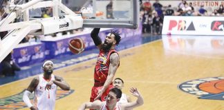 San Miguel Beermen’s Devon Scott attacks the defense of NorthPort Batang Pier’s Robert Bolick Jr. with a one-handed dunk. PBA MEDIA BUREAU