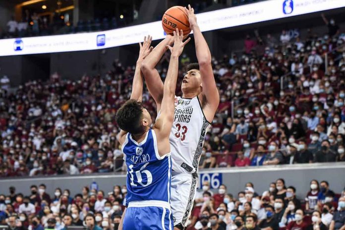 sports-UP-pic-and-caption University of the Philippines Fighting Maroons’ Carl Tamayo attempts a tough jumper against the defense of Ateneo de Manila University Blue Eagles’ Josh Lazaro. UAAP MEDIA BUREAU