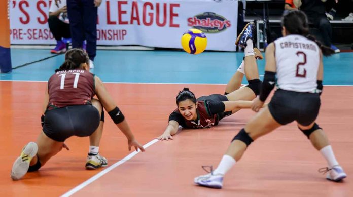 sports-UP-pic-and-caption Negrense Nikha Cabasac of University of the Philippines Fighting Maroons saves the ball as two of her teammates look on. PHOTO COURTESY OF SHAKEY’S SUPER LEAGUE