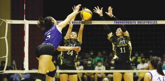Ateneo de Manila University Blue Eagles’ Vanessa Gandler was blocked by the defense of Bacolodnon Cassie Carballo (24) and Athena Abbu (11) of University of Santo Tomas Golden Tigresses. PHOTO COURTESY OF JOSELLE MARIE B. REYES/THE VARSITARIAN