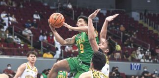 Ilonggo John Bryan Sajonia of Far Eastern University Tamaraws attacks the defense of Capiznon Christian Manaytay of University of the Santo Tomas Growling Tigers for a layup. UAAP MEDIA BUREAU PHOTO