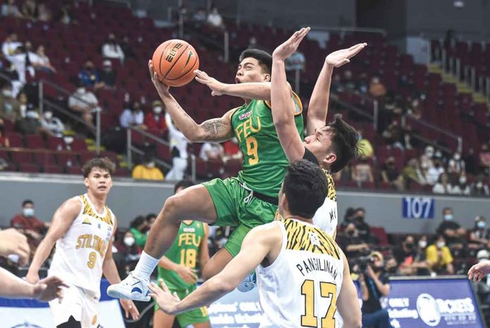sports-ilonggo-1 Ilonggo John Bryan Sajonia of Far Eastern University Tamaraws attacks the defense of Capiznon Christian Manaytay of University of the Santo Tomas Growling Tigers for a layup. UAAP MEDIA BUREAU PHOTO