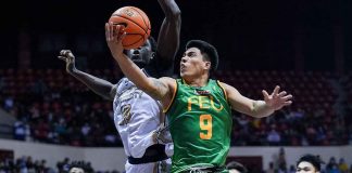 Ilonggo John Bryan Sajonia of Far Eastern University Tamaraws bravely attacks the defense of National University Bulldogs center Omar John for a layup. UAAP MEDIA BUREAU PHOTO