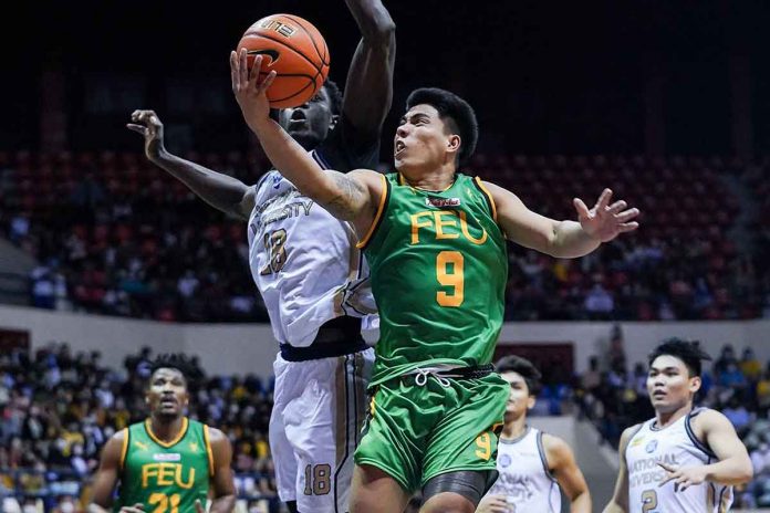 sports-sajonia Ilonggo John Bryan Sajonia of Far Eastern University Tamaraws bravely attacks the defense of National University Bulldogs center Omar John for a layup. UAAP MEDIA BUREAU PHOTO