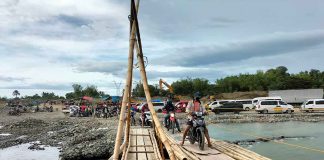 The bulk of funds needed to restore storm-damaged infrastructures in Western Visayas will go to the province of Antique, data from the Department of Public Works and Highways show. Photo shows motorcycles crossing a makeshift bridge at the Paliwan River in Antique. PROVINCE OF ANTIQUE FACEBOOK PAGE PHOTO