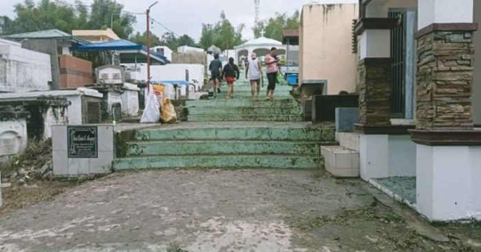 cemetery Residents of the municipality of Sibalom, Antique arrive in trickles at the public cemetery on Oct. 31, 2022. Continuous rainfall since Oct. 28, induced by Severe Tropical Storm “Paeng” created muddy trails. ANNABEL CONSUELO J. PETINGLAY/PNA PHOTO