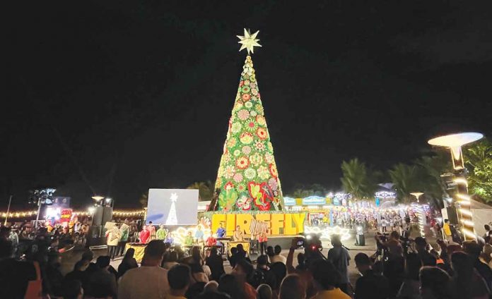 firefly Firefly returns with a brighter and merrier Christmas starting with its annual Christmas Tree Lighting event at SM By The Bay on Nov. 11. Photo shows Firefly’s 70-foot Christmas tree bearing its message to millions of Filipinos who flock to this spot every year: “CeleBright New Beginnings as One Country.”