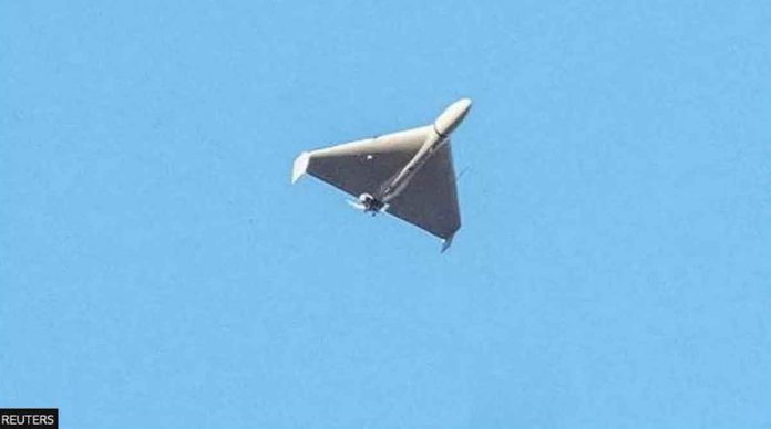 A drone, believed to be Iranian, flies above Kyiv. REUTERS