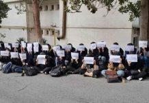 Iran university students stage sit-down strikes A photo posted by Iran’s Human Rights Activists News Agency shows a sit-in strike by students at the women-only Al-Zahra University in Tehran.