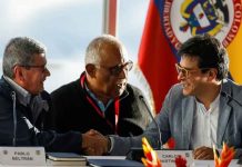 Colombia in new peace talks with rebels ELN delegation head Pablo Beltrán (L) shakes hands with Colombian negotiator Danilo Rueda in Caracas. Reuters