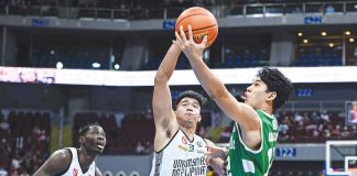 De La Salle University Green Archers’ Earl Abadam scoops for a layup as University of the Philippines Fighting Maroons’ Richi Calimag attempts for a block. UAAP PHOTO