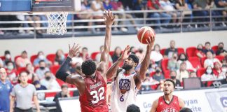 NLEX Road Warriors’ Earl Clark scores against the defense of Barangay Ginebra San Miguel Kings’ Justin Brownlee. PBA PHOTO