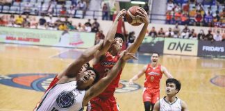NorthPort Batang Pier’s William Navarro emphatically grabs the ball from Terrafirma Dyip center Joseph Gabayni during a rebound battle. PBA MEDIA BUREAU