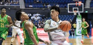 University of the Philippines Fighting Maroons’ James Spencer puts out his elbow to protect the ball from Far Eastern University Tamaraws’ Royce Alforque. UAAP MEDIA BUREAU