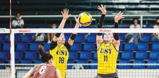 University of Santo Tomas Golden Tigresses’ Regina Jurado and Athena Abbu foil the attack of Bacolodnon Joan Marie Monares of the University of the Philippines Fighting Maroons. VARSITARIAN SPORTS PHOTO