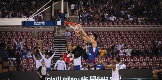 Gilas Pilipinas’ Kai Sotto hangs on the ring for a two-handed dunk during their game against Saudi Arabia in the fifth window of the 2023 FIBA World Cup Asian Qualifiers in Jeddah, Saudi Arabia. FIBA Photo