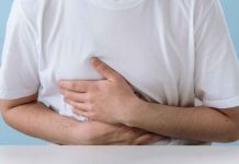 Ajuy food poisoning victims rise to 40 Man in White Shirt Suffering from a Stomach Pain.