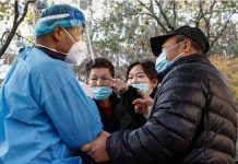 China COVID cases soar to new record Desperate Chinese citizens confront a healthcare worker. EPA