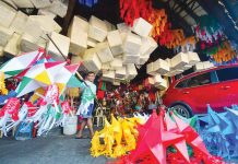 Gov’t offers MSMEs loans for workers’ 13th month pay A worker arranges lanterns on sale in a market in Quezon City. MARK DEMAYO/ABS-CBN NEWS PHOTO