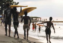 Tourism revenues hit P149-B as of November Men carry surf boards as they walk along the beach in San Juan, La Union – a popular tourist spot. BASILIO H. SEPE/ABS-CBN NEWS PHOTO
