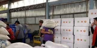 The Iloilo City government’s City Social Welfare and Development Office delivers food items such as rice and canned goods, and non-food items like sleeping mats and mosquito nets to families affected by fire in Barangay Veterans Village, City Proper on Dec. 26. ILOILO CSWDO FB PHOTO
