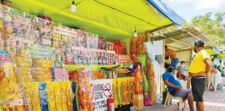 The Department of Health is relentless in its campaign for safer and healthier holidays. Instead of firecrackers that cause injuries, it is promoting alternative modes of making celebratory noise. File photo shows vendors selling firecrackers at a stall in Barangay Buhang, Jaro, Iloilo City on Dec. 20, 2021. PN FILE PHOTO
