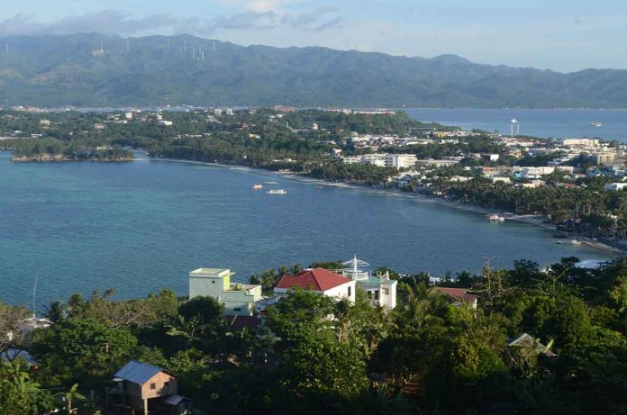 front-pic Boracay Island – which is entirely limestone – is vulnerable to sinkholes, according to the result of the Karst Subsidence Hazard Mapping conducted by Mines and Geosciences Bureau of the Department of Environment and Natural Resources in Western Visayas. Photo shows Boracay Island as seen from the Mt. Luho View Deck in Barangay Yapak, Malay, Aklan. PN PHOTO