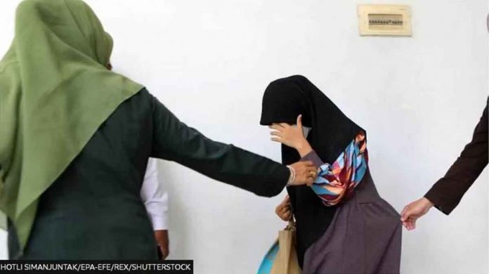 indonesia A woman in Aceh, Indonesia, before being caned in November for having sex outside of marriage. Aceh province already has strict laws against sex outside marriage.