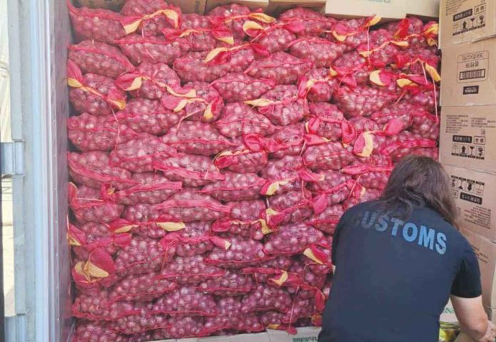 onions The Bureau of Customs-Port of Cagayan de Oro seizes two containers of smuggled onions concealed in bread and pastry products following a spot-check at Mindanao Container Terminal Port, PHIVIDEC Compound, Tagoloan in Misamis Oriental on Dec. 21, 2022. BOC-PORT OF CAGAYAN DE ORO PHOTO