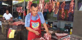 Pok vendor Ernesto Gulaylay, who has a stall at the public market of Pavia, Iloilo, notices a decrease in sales since the province recorded cases of African Swine Fever. AJ PALCULLO/PN