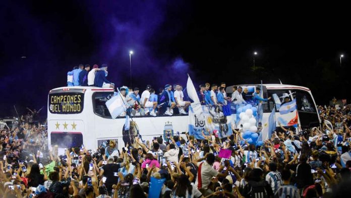 sports-World-Cup The Argentina football team on a bus in Buenos Aires on Dec. 20, 2022 surrounded by cheering fans. REUTERS