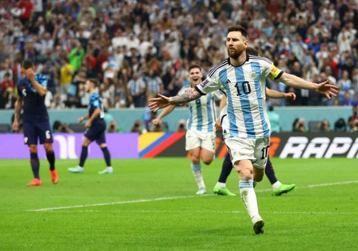 sports-World-Cup-pic-and-caption Lionel Messi celebrates after scoring Argentina’s first goal from the penalty spot. CARL RECINE/REUTERS