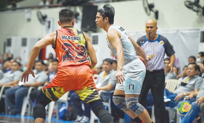 sports-acster Acster Marketing’s Alwyn Alday dribbles the ball against a RA-AK Transport defender. PHOTO COURTESY OF STEPHEN TAN