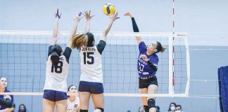 Ateneo de Manila University Blue Eagles’ Faith Nisperos attempts a drop shot against the double wall defense of Adamson University Lady Falcons. V-LEAGUE PHOTO