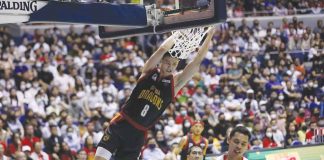 Bay Area Dragons’ Zhu Songwei skies for a two-handed dunk after blowing past the defense of Barangay Ginebra San Miguel Kings’ Japeth Aguilar. PBA PHOTO