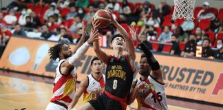 Bay Area Dragons’ Songwei Zhu attacks the defense of San Miguel Beermen’s June Mar Fajardo and Devon Scott for a layup. PBA PHOTO