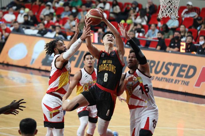 sports-bay Bay Area Dragons’ Songwei Zhu attacks the defense of San Miguel Beermen’s June Mar Fajardo and Devon Scott for a layup. PBA PHOTO