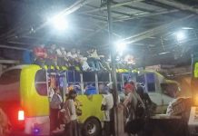 Vallacar Transit statement on yellow bus with passengers seated on the roof iFM BACOLOD 943 PHOTO
